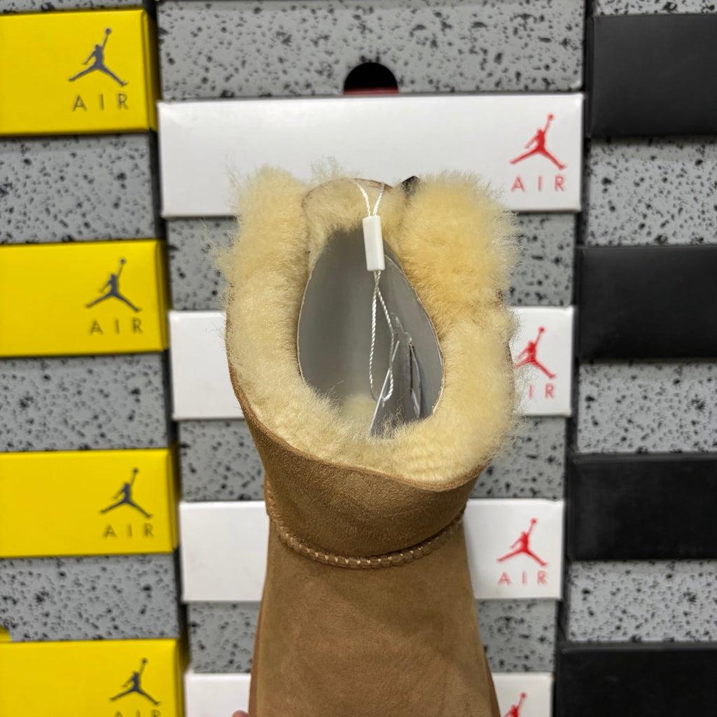 UGG Mini Bailey Bow Ankle Boot – Suede Boot with Cream Shearling Lining, Dark Chocolate Satin Bow & Tan Sugar Sole in Chestnut